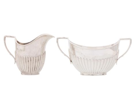 A Victorian silver cream jug and sugar bowl, sugar bowl 14.3cm over handles, marks rubbed, by Mappin &amp; Webb, London 1895,