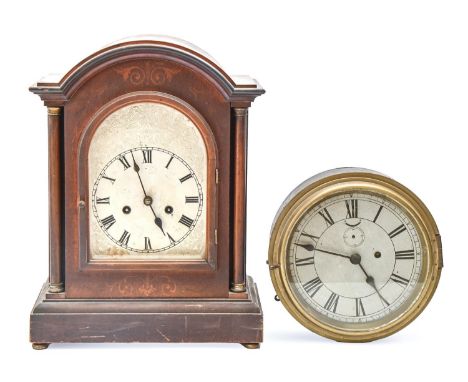 A German mahogany-stained and inlaid breakarched mantel clock, c1900, with pillars and silvered dial, the movement striking o