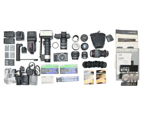 An Olympus-D E-M10 camera and various Olympus and other camera lenses / guns and accessories  All in apparently good conditio