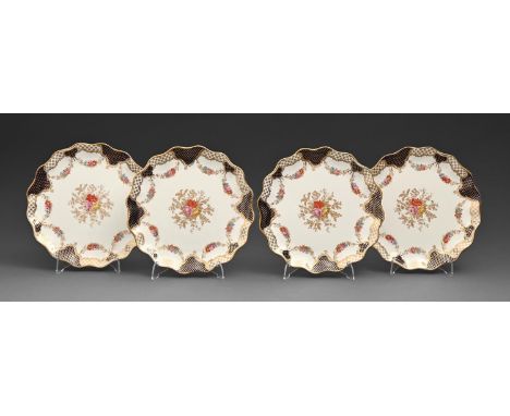 A set of four Wedgwood bone china dessert plates, early 20th c, with cobalt and gilt scale and trellis border, 21cm diam, pri