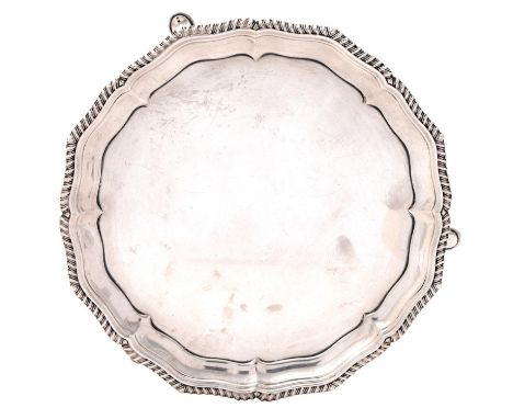 An Edwardian silver waiter, with gadrooned rim, on hoof feet, 15cm diam, maker's mark rubbed, London 1908, 6ozs 12dwts  Good 