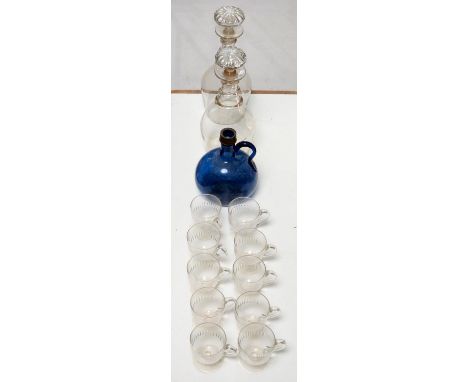 A pair of glass Prussian decanters and moulded mushroom stoppers, 19th c, with three neck rings, 27cm h, a blue glass flagon 