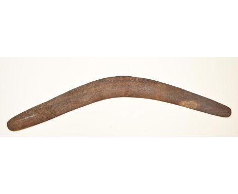 An Australian aboriginal wood boomerang, first half 20th c, 67.5cm l  Old water stains and old dirt but not chipped or split