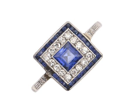 A sapphire and diamond cluster ring, with larger central step cut sapphire and calibre cut sapphire surround, in platinum (11