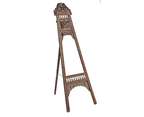 A North Indian carved and pierced wood easel, c1900, 179cm h  Small losses and repairs