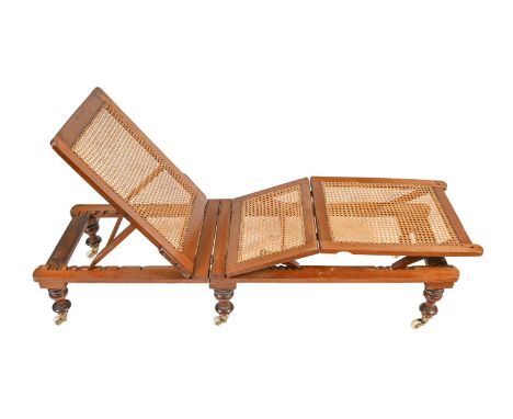 Campaign furniture. A Victorian mahogany and caned daybed, c1865-1875, fully adjustable, on six turned legs and brass and whi