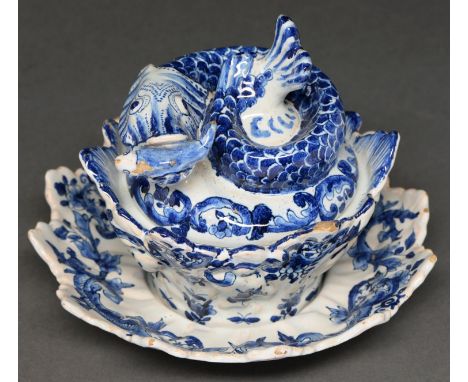 A Dutch Delftware fish sauce tureen, cover and stand, Jan van der Kloot, c1765, painted in shades of cobalt with scrolling fo
