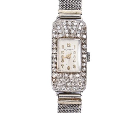 A diamond cocktail watch, c1940, millegrain set in platinum, 13 x 26mm, on white gold mesh bracelet, engraved buckle marked 9