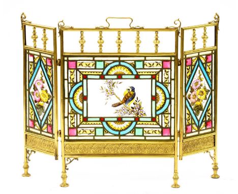 A Victorian folding brass and stained glass firescreen, painted with a bird on blossom and flowers, 63 x 84cm  One or two sma