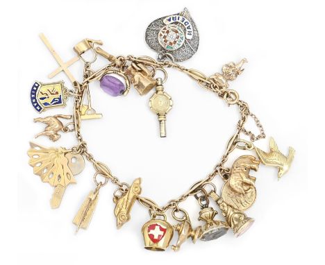 A gold charm bracelet, the charms including lyre, kettle, amethyst swivel, toby jug and watch key and one silver filigree and