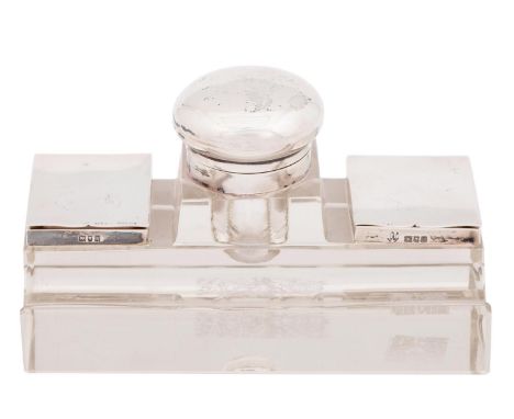 An Edwardian silver mounted glass inkwell, with two lidded postage stamp compartments and pen rest, 12.5cm l, by Corke Brothe