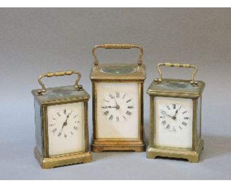 A French gong striking carriage clock, eight day movement, and two others