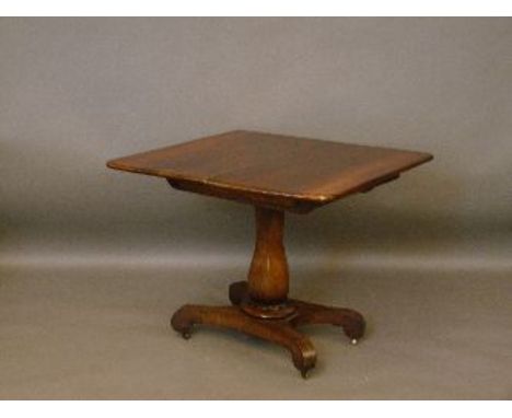 A Victorian mahogany card table, with baluster column, 90cm wide, 45cm high