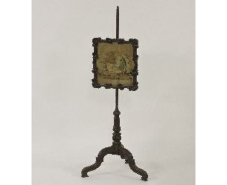 A William IV oak pole screen, with a carved tripod base, 126cm high