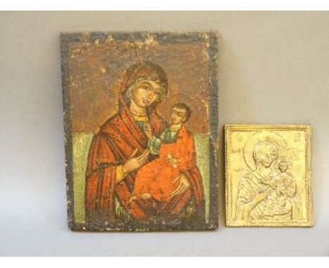 A Russian icon of Madonna and Christ, polychrome on wooden panel, possibly 18th century, together with a brass icon