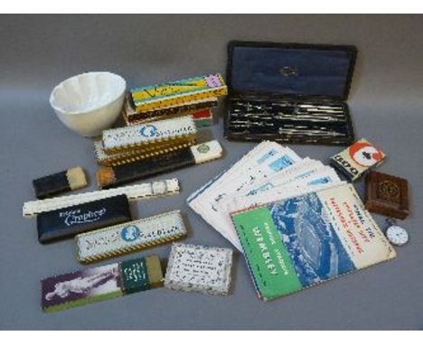 A collection of miscellaneous items, football programmes, eight vintage boxes of pencils, calligraphy pen, playing cards, tra