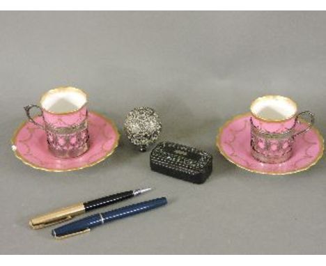 A pair of Aynsley coffee cans and saucers, in silver holders, a mother of pearl snuff box, etc