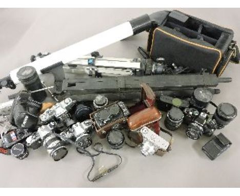 A large quantity of 35mm SLR and other cameras and accessories, to include a Zeiss Ikon 'Symbolica', Canon ex auto, a scratch