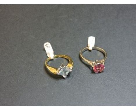 An 18ct gold single stone aquamarine ring, and an 18ct white gold single stone pink tourmaline ring