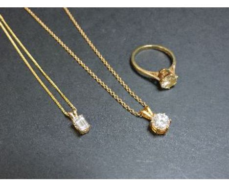 Two 9ct gold cubic zirconia single stone pendants, and a 9ct gold single stone ring set with a diamond simulant