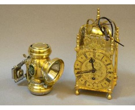 A reproduction brass carriage clock, and Zephyr brass oil bicycle lamp