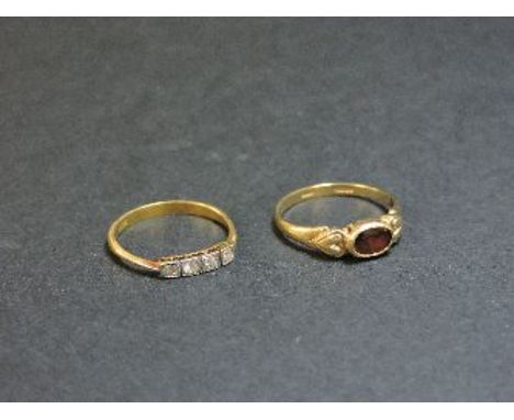 A 9ct gold garnet ring, and an Art Deco four stone diamond ring marked 18ct