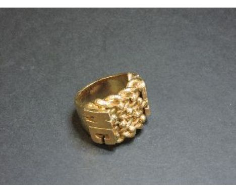 A 9ct gold four row shot ring, with applied initial shoulders 'MC', 56.1g approximately