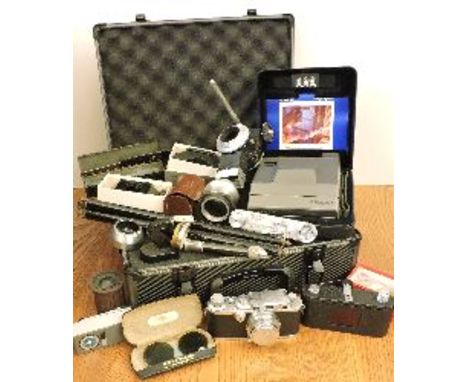 A Leica 111a Range finder camera, 1936 chrome, serial No 298771, with lens cap in case, together with a collection of photogr