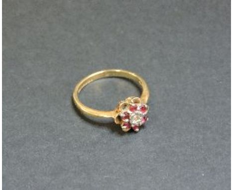 A 9ct gold diamond and ruby cluster ring