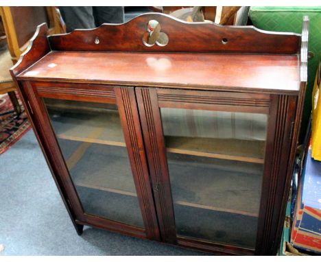 A VICTORIAN MAHOGANY GLAZED WALL SHELF, 71cm wide together a small bamboo framed mirror, the frame painted with blue tits (2)