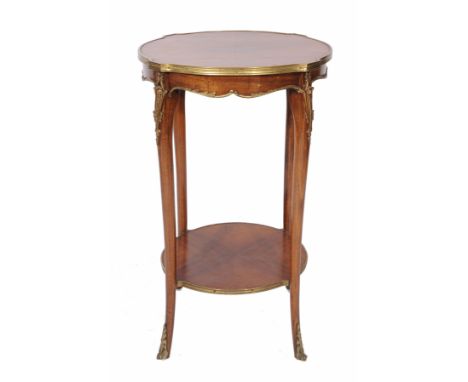 A SMALL CONTINENTAL KING WOOD AND GILT METAL MOUNTED TWO TIER OCCASIONAL TABLE , with shaped quarter veneered top, slender ca