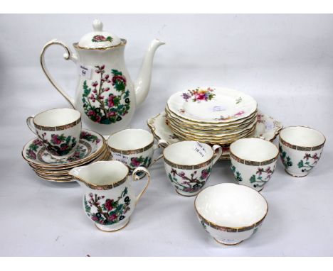 A ROYAL WORCESTER PORCELAIN CASE SET OF SIX COFFEE CANS AND SAUCERS decorated with white roses together with a Royal Grafton 