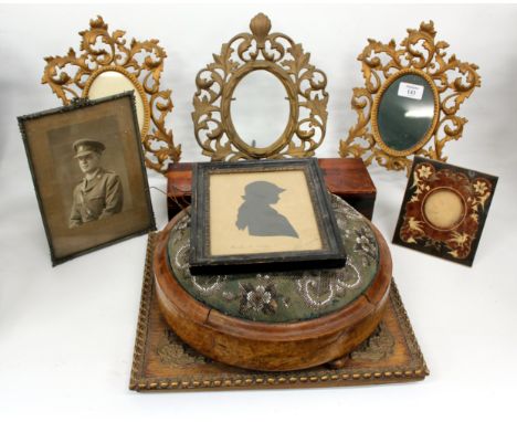A PAIR OF VICTORIAN CAST IRON GILT DECORATED PICTURE FRAMES with oval aperture and pierced scrolling foliate surround, each s