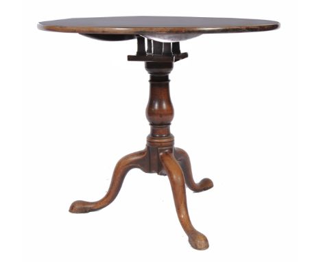 A GEORGIAN MAHOGANY CIRCULAR TILT TOP TRIPOD TABLE with bird cage support, a turned baluster column, 84cm diameter