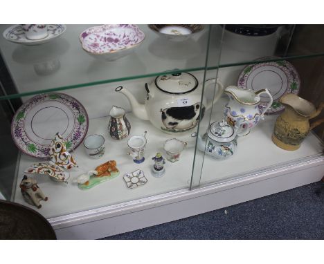 A SMALL QUANTITY OF VARIOUS CERAMICS to include a teapot decorated with farm animals, a 19th century English bone china jug d