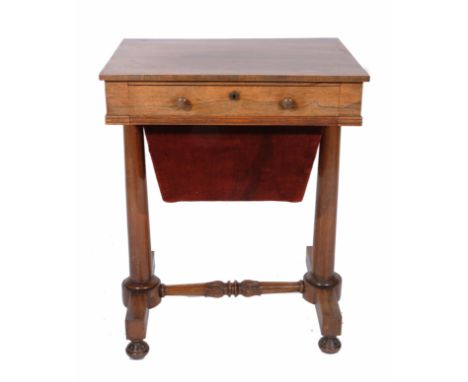 A 19TH CENTURY ROSEWOOD WORK TABLE, the single drawer opening to reveal divisions within, over a red velvet upholstered wall 