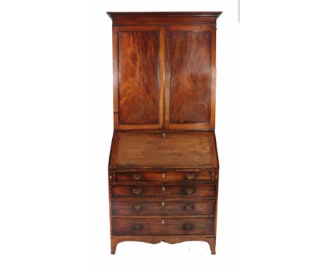 A GEORGIAN MAHOGANY BUREAU BOOK CASE, the associated upper section with panelled doors enclosing adjustable shelves over a bu