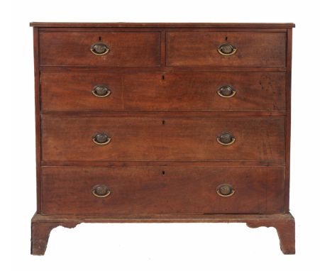 A GEORGIAN MAHOGANY CHEST of two short and three long drawers standing on bracket feet and with brass fleur de lys decorated 