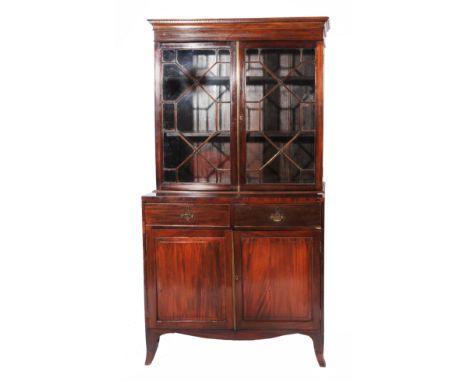 A LATE GEORGE III MAHOGANY LIBRARY BOOKCASE with astragal glazed doors enclosing adjustable shelves above two drawers and two