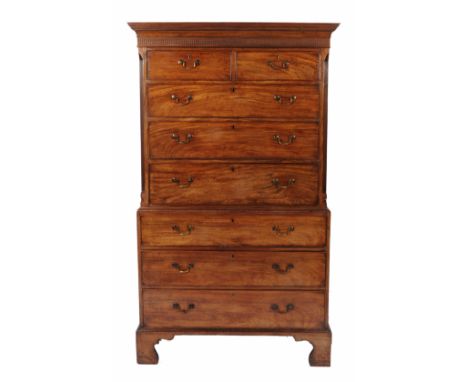 A GEORGE III MAHOGANY TALLBOY, with canted corners, two short and three long drawers, all with lacquered brass swan neck hand