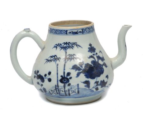 AN 18th CENTURY CHINESE EXPORT BLUE AND WHITE PORCELAIN TEAPOT of baluster form decorated with camellia flowers, a fence and 