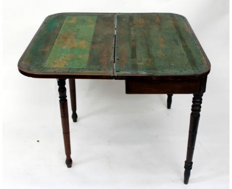 A GEORGE III MAHOGANY CARD TABLE with rounded corners standing on turned tapering legs, 94cm wide