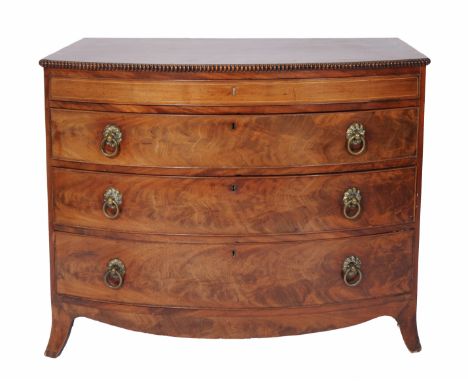 A 19TH CENTURY, POSSIBLY CHANNEL ISLANDS, BOW FRONT MAHOGANY CHEST of four long drawers, brass ring handles and standing on s