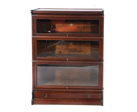 A DARK STAINED THREE SECTIONED GLOBE-WERNICKE BOOKCASE with shaped drawer to the base, 86.5cm wide x 120cm high
