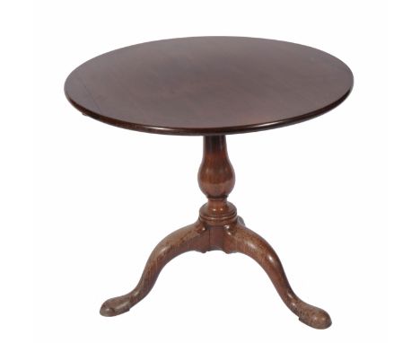 A GEORGIAN CIRCULAR MAHOGANY TILT TOP TRIPOD TABLE with baluster support and tripod base, 79.5cm diameter