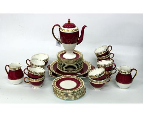 A WEDGEWOOD PORCELAIN COFFEE SET in the Whitehall pattern, coffee pot, cups and saucers, side plates and bread and butter pla
