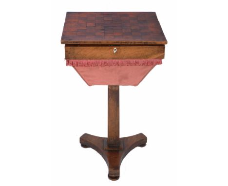 A SMALL ROSEWOOD RECTANGULAR GAMES TABLE with inlaid top and fitted interior standing on square section column support and pl