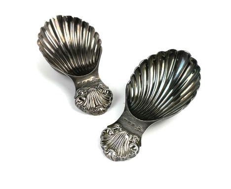 A pair of modern silver George III style caddy spoons by A C &amp; Sons Ltd. The handles scallop shell cast and with shell bo