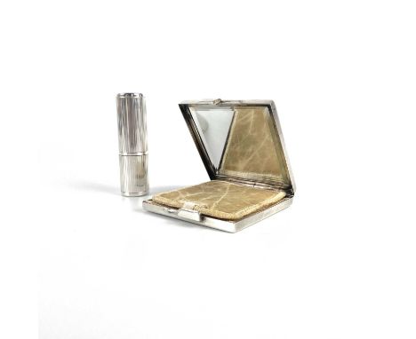 A sterling silver compact and cylindrical perfume bottle. Both stamped STERLING, gross weight 108g.The scent bottle has a sli