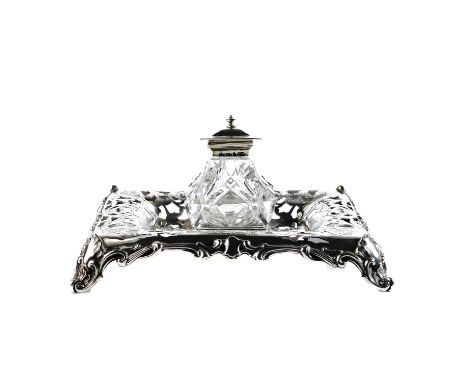 A good Victorian silver ink stand by Henry Wilkinson &amp; Co. Of recatangular form with pierced and engraved scroll decorati
